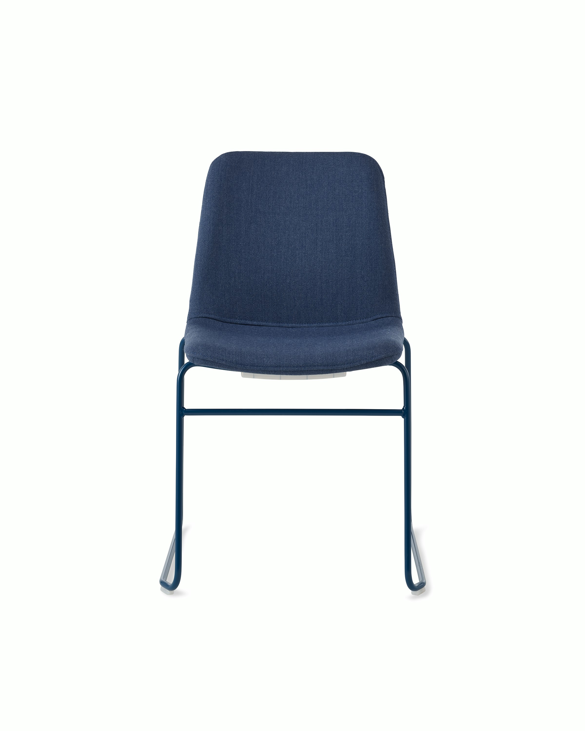 White sweep of Viv chair with dark blue fabric and dark blue steel sled base