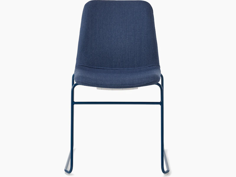 White sweep of Viv chair with dark blue fabric and dark blue steel sled base