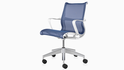 A front three quarter view of a blue and silver Setu chair by Herman Miller