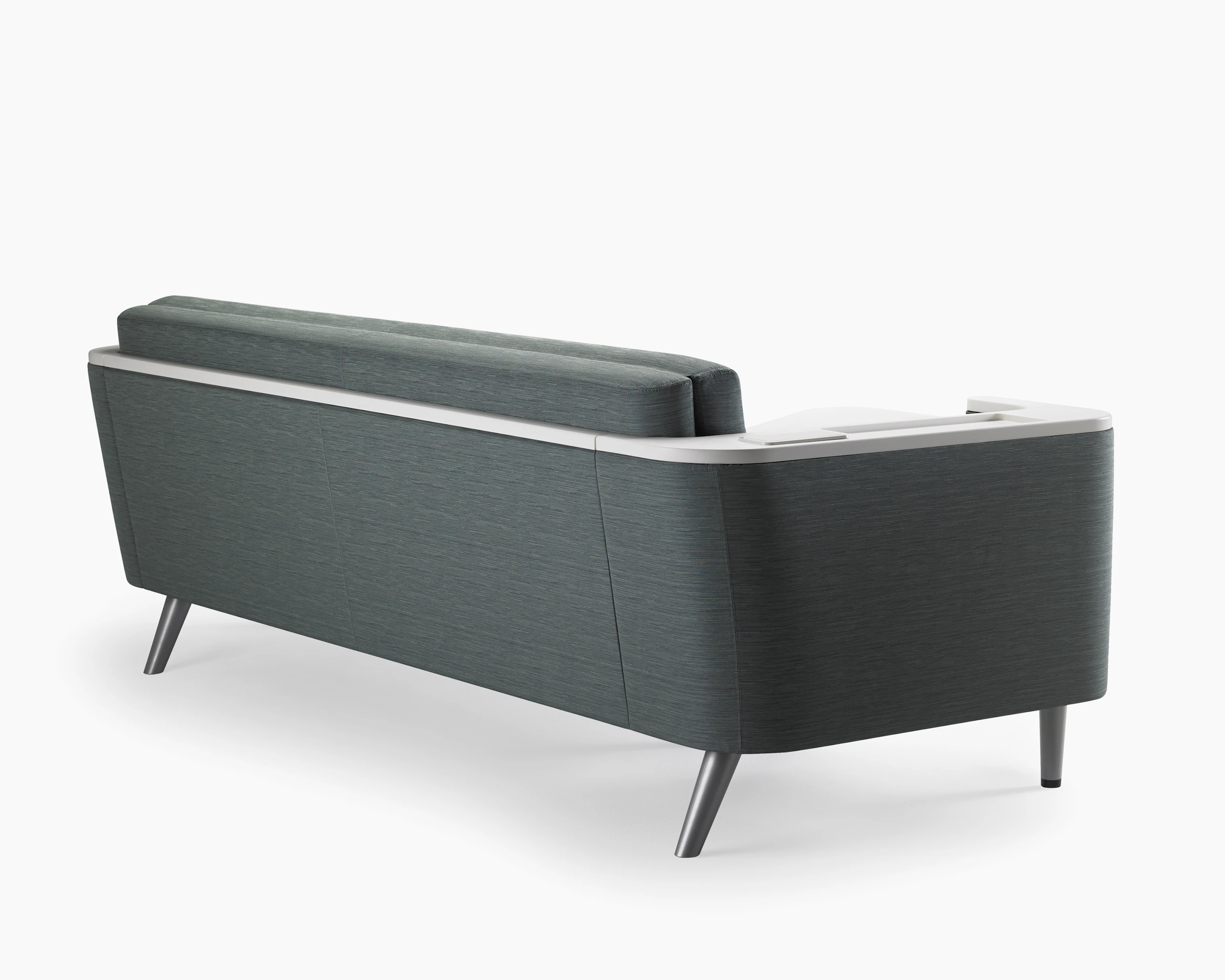 Detail of the back of Nemschoff Palisade Flop Sofa showing the solid surface arm and back cap.