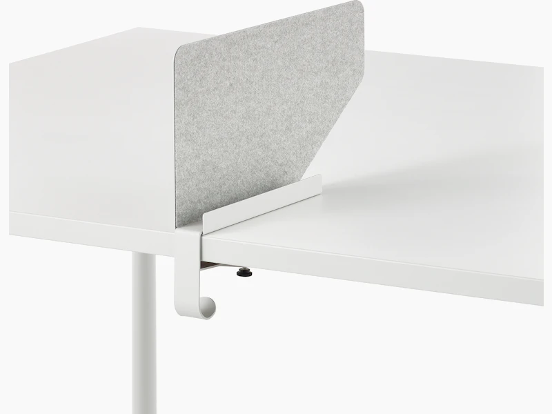 Grey OE1 Boundary Screen with liner on a white OE1 Rectangular Table, viewed from an angle.
