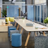 rockwell unscripted library table upholstered seats swivel stools steps laptop tray tall table drink rail creative wall filzfelt hanging panels fixed fins glass assembly community immersive open room muuto fiber side chair hospitality team meeting