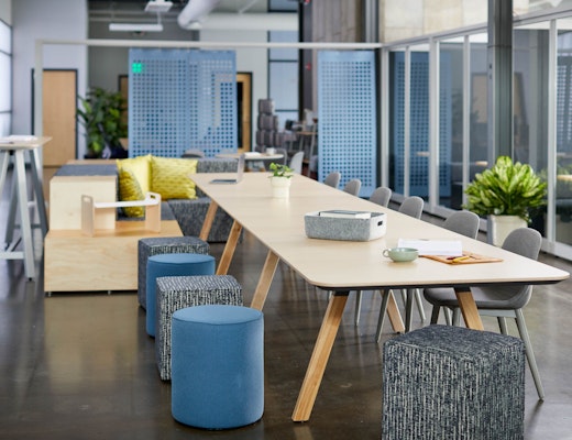 Rockwell Unscripted Community Space rockwell unscripted library table upholstered seats swivel stools steps laptop tray tall table drink rail creative wall filzfelt hanging panels fixed fins glass assembly community immersive open room muuto fiber side chair hospitality team meeting