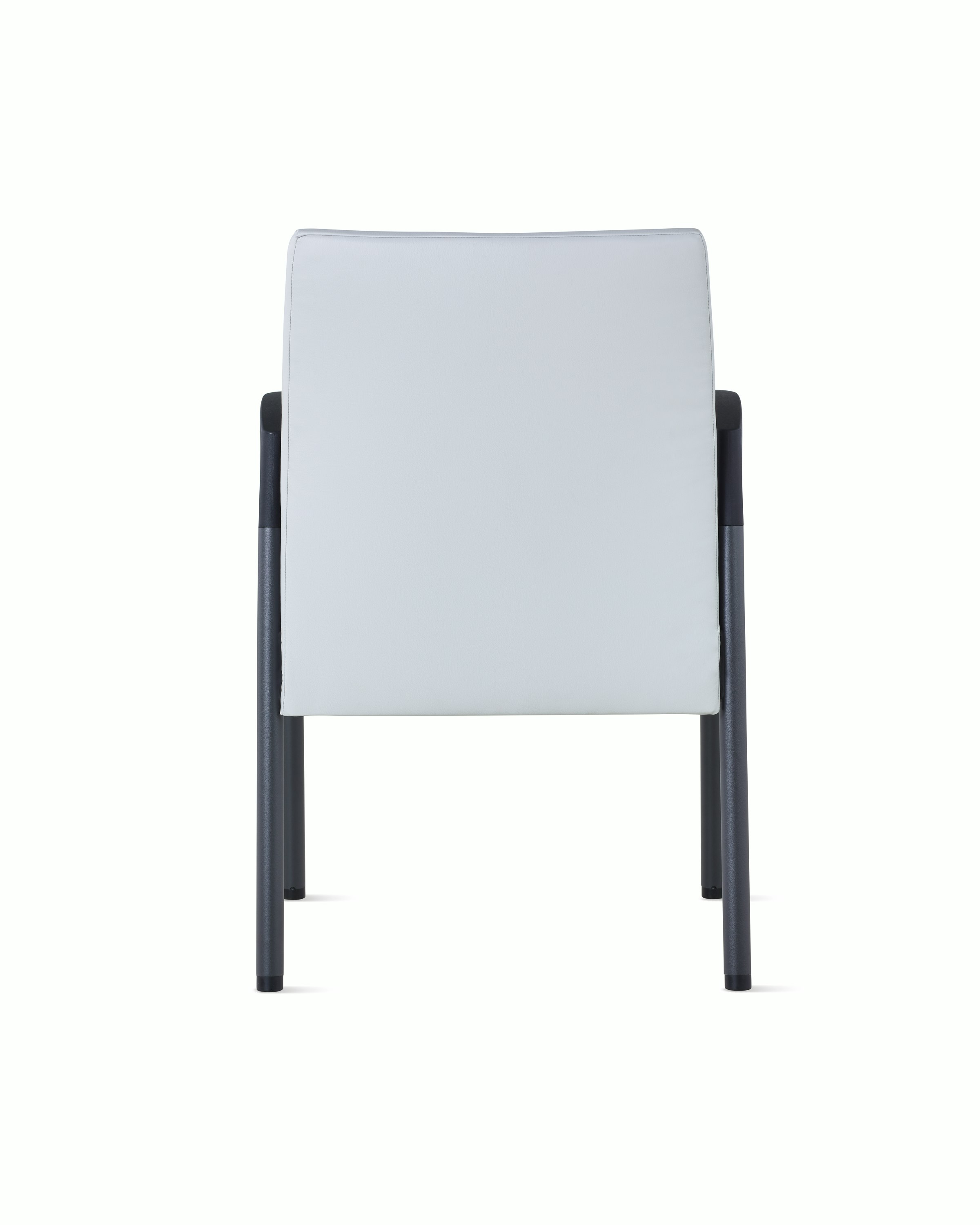 Back view of Valor Side Chair in a light gray upholstery on the back and a black metal frame.