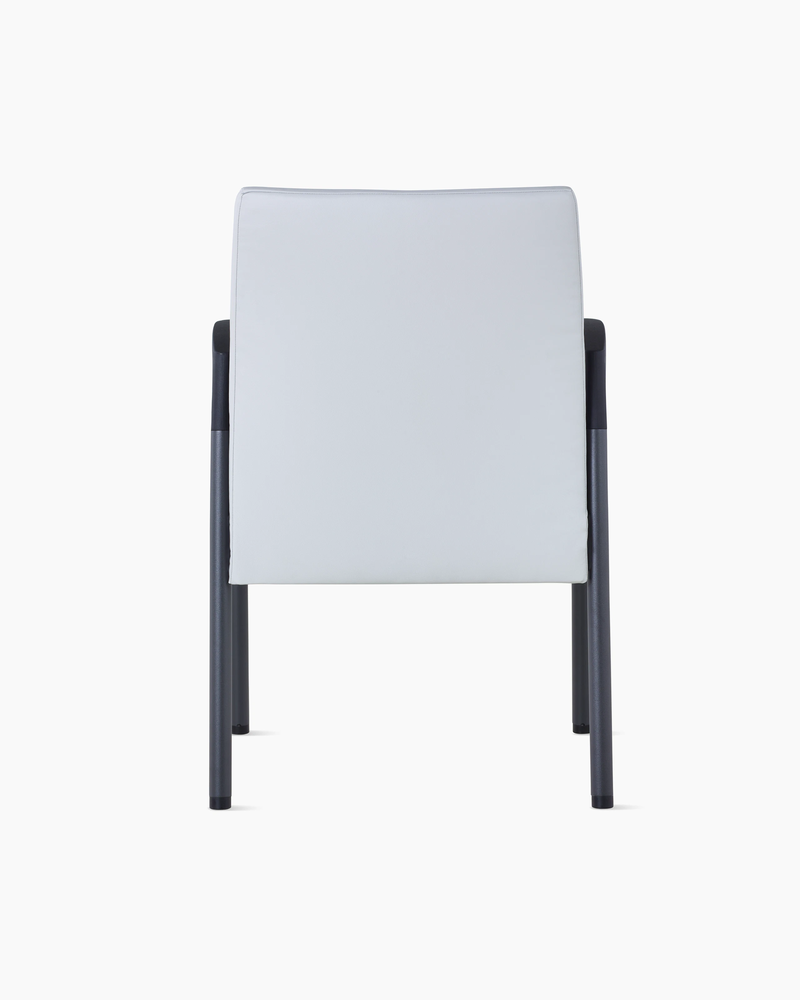 Back view of Valor Side Chair in a light gray upholstery on the back and a black metal frame.