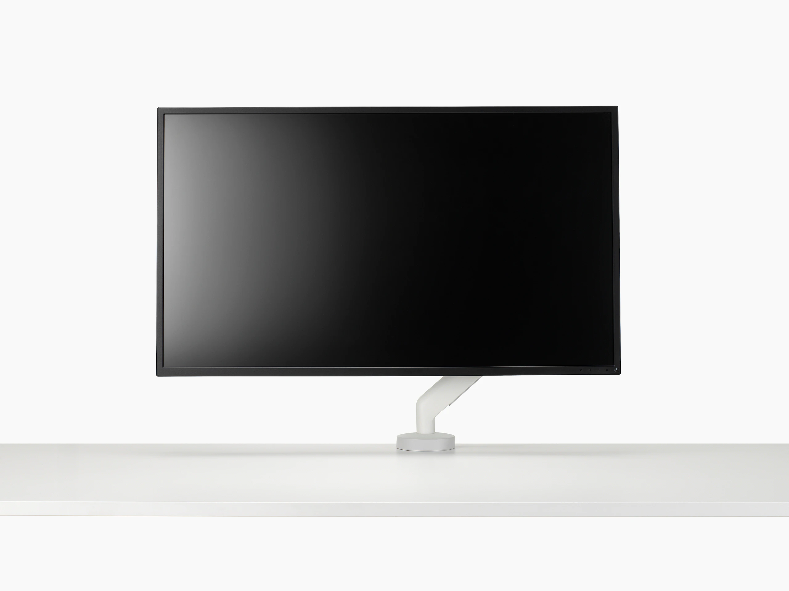 White single Flo X arm with a 43'' screen, viewed from the front
