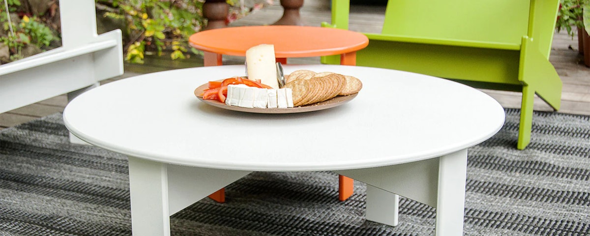 Lollygagger Cocktail Table with plate of cheese and crackers in an outdoor patio setting