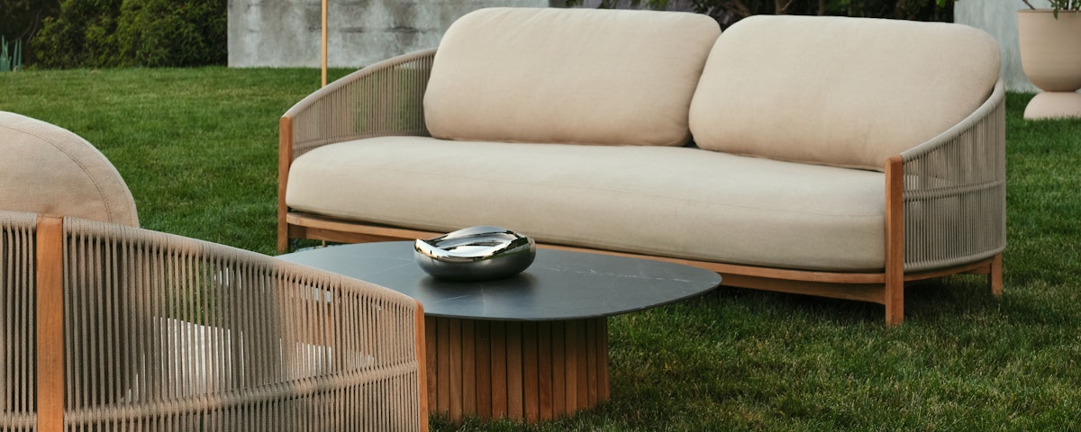 Softlands Outdoor Sofa and Coffee Table in an outdoor lawn setting