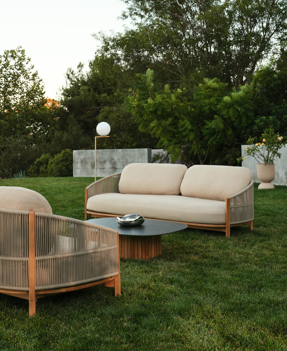 Front view of beige cushioned 2-seat sofa with wooden frame
