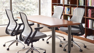Four ReGeneration Chairs by Knoll, around a meeting table with a bookshelf in the background.