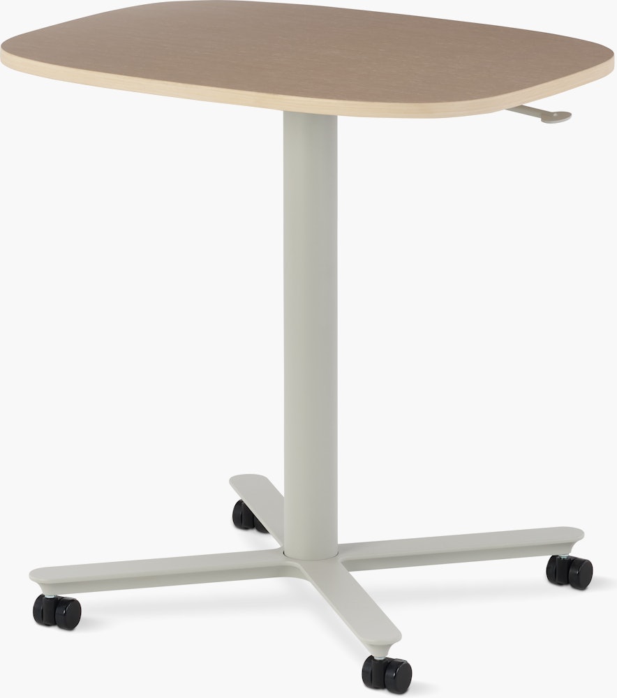 Large Passport Work Table with light woodgrain surface and light gray base on casters.