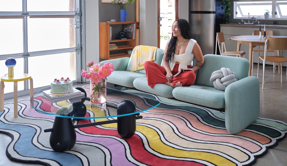 Jasmine Archie with Wilkes and Wavy rug in her living room