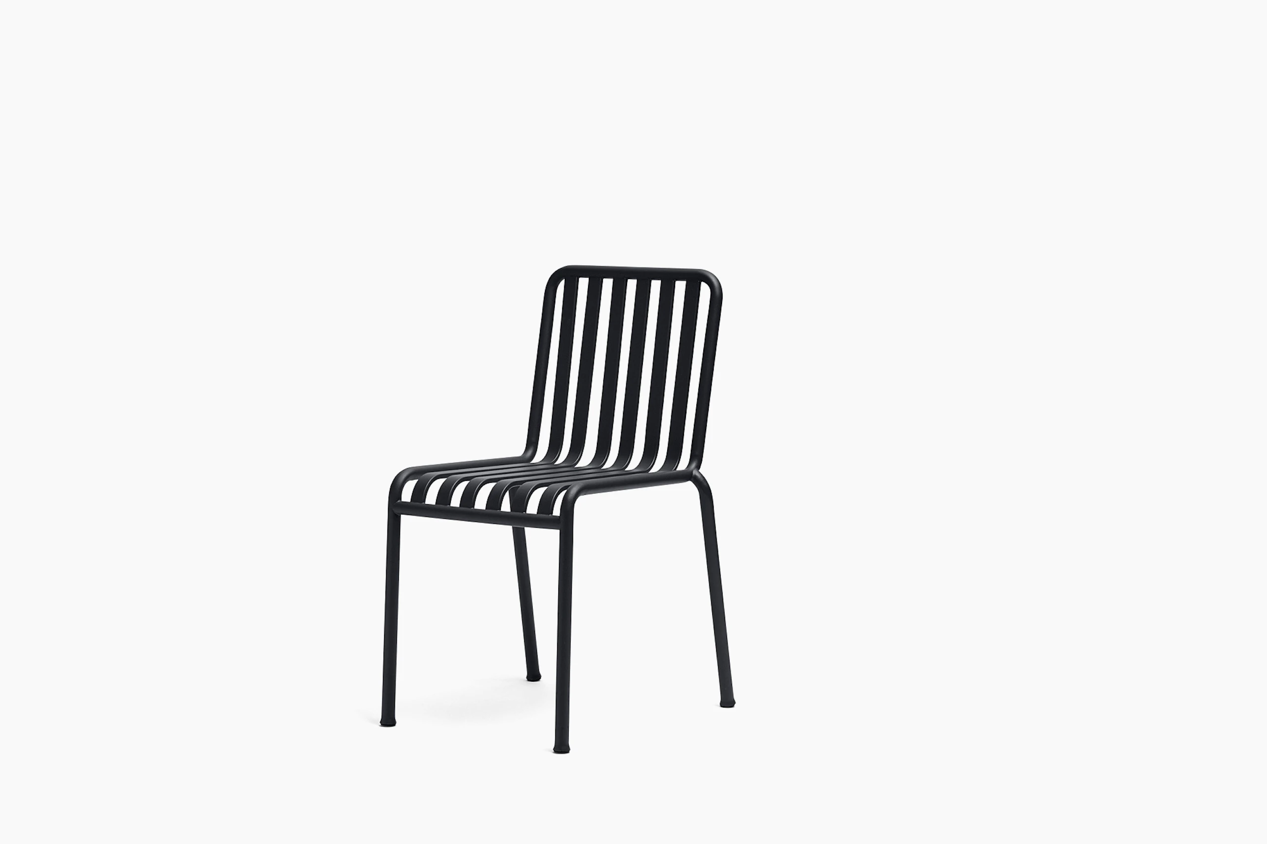 Three quarter view of a Palissade Chair without arms in dark grey.