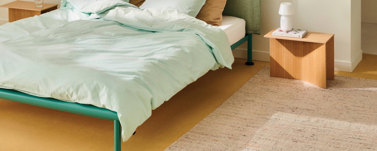 Crayon Rug and Tamoto Bed in a bedroom setting