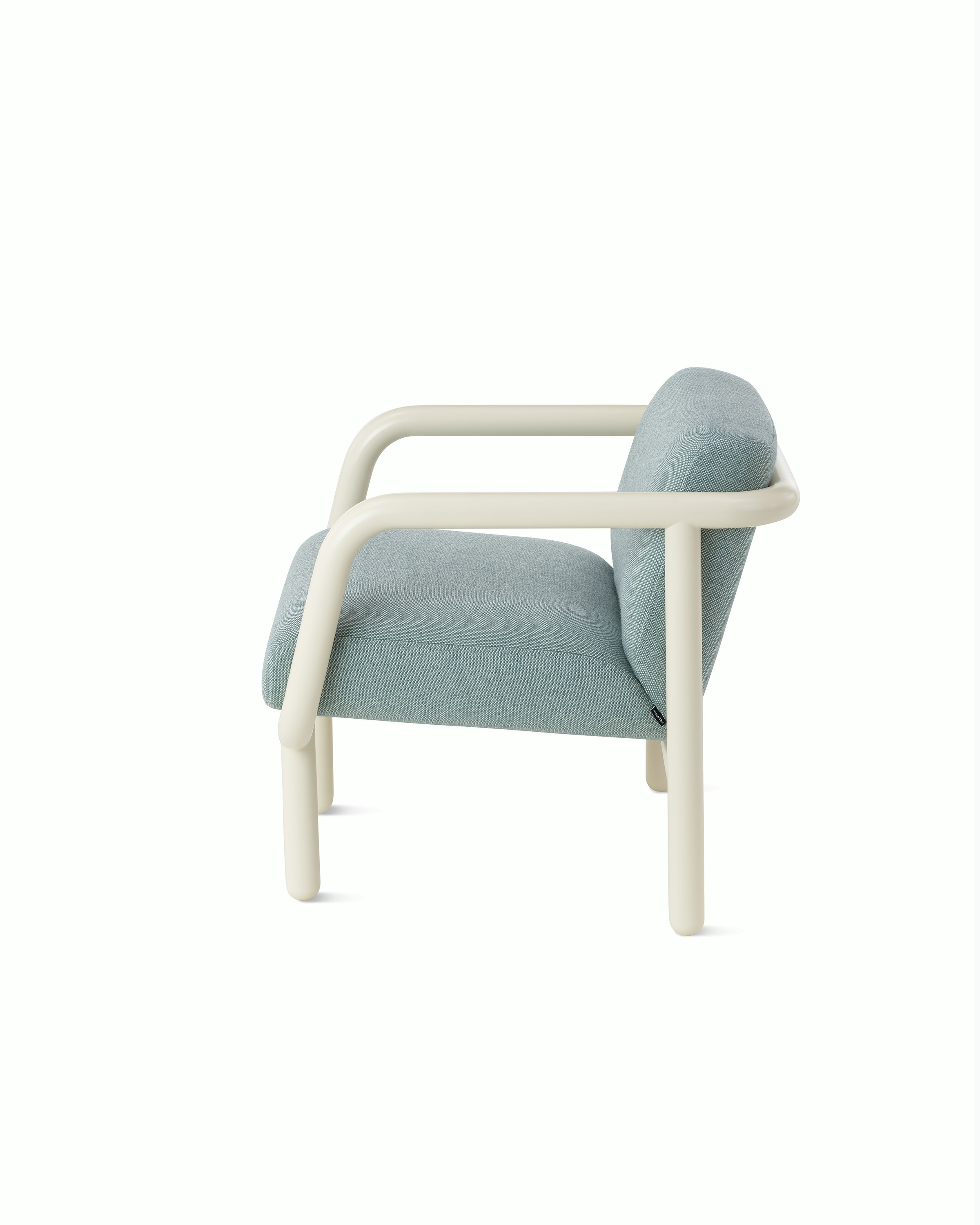 White background shot of Percy lounge chair with an oyster frame and pale blue upholstery.