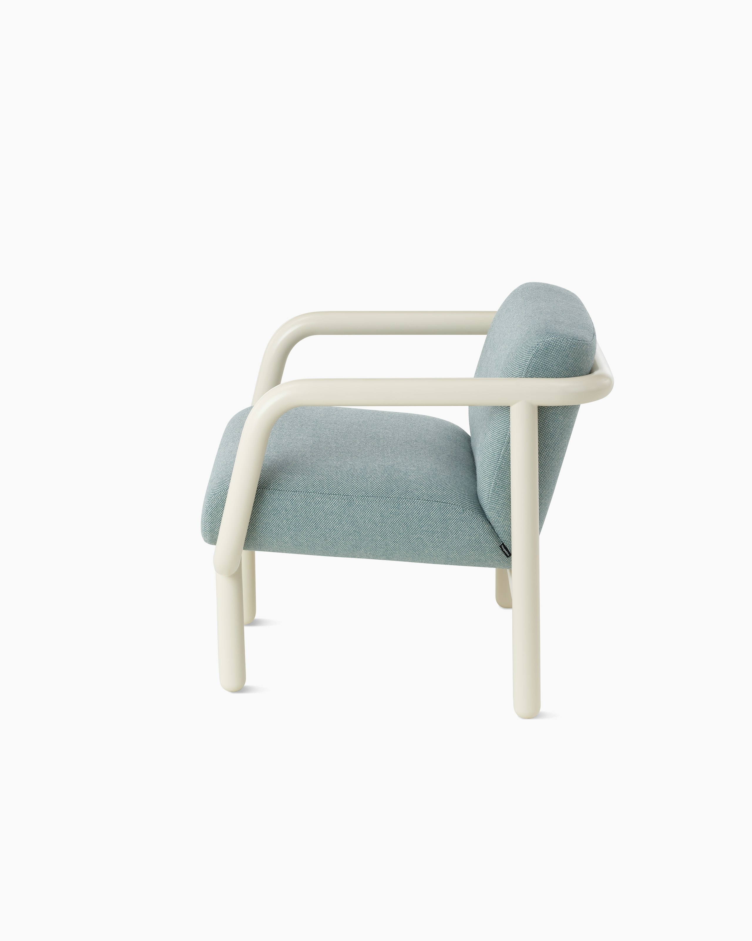 White background shot of Percy lounge chair with an oyster frame and pale blue upholstery.