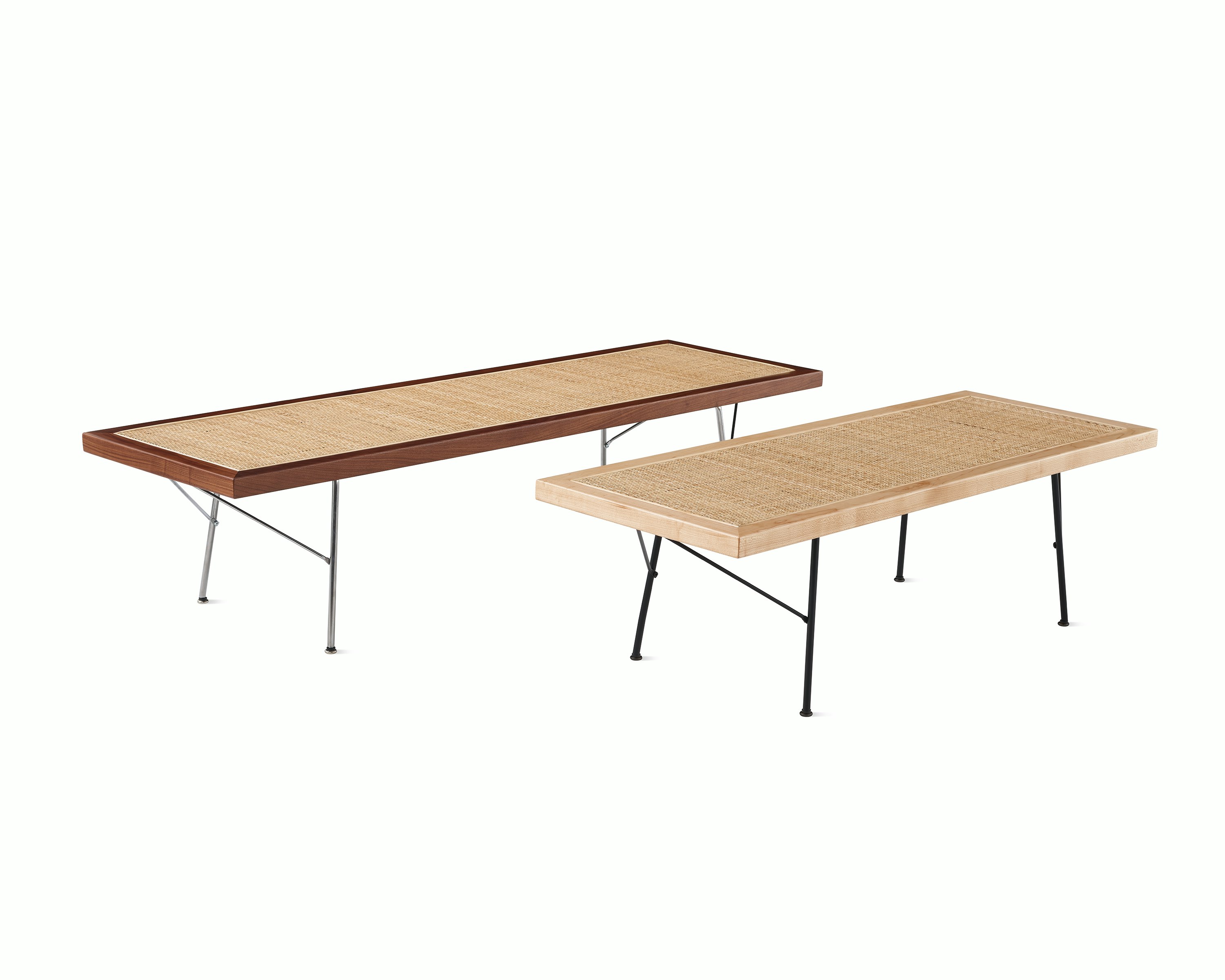 Two Nelson Cane Benches next to each other, one with a walnut frame and the other with a maple frame.