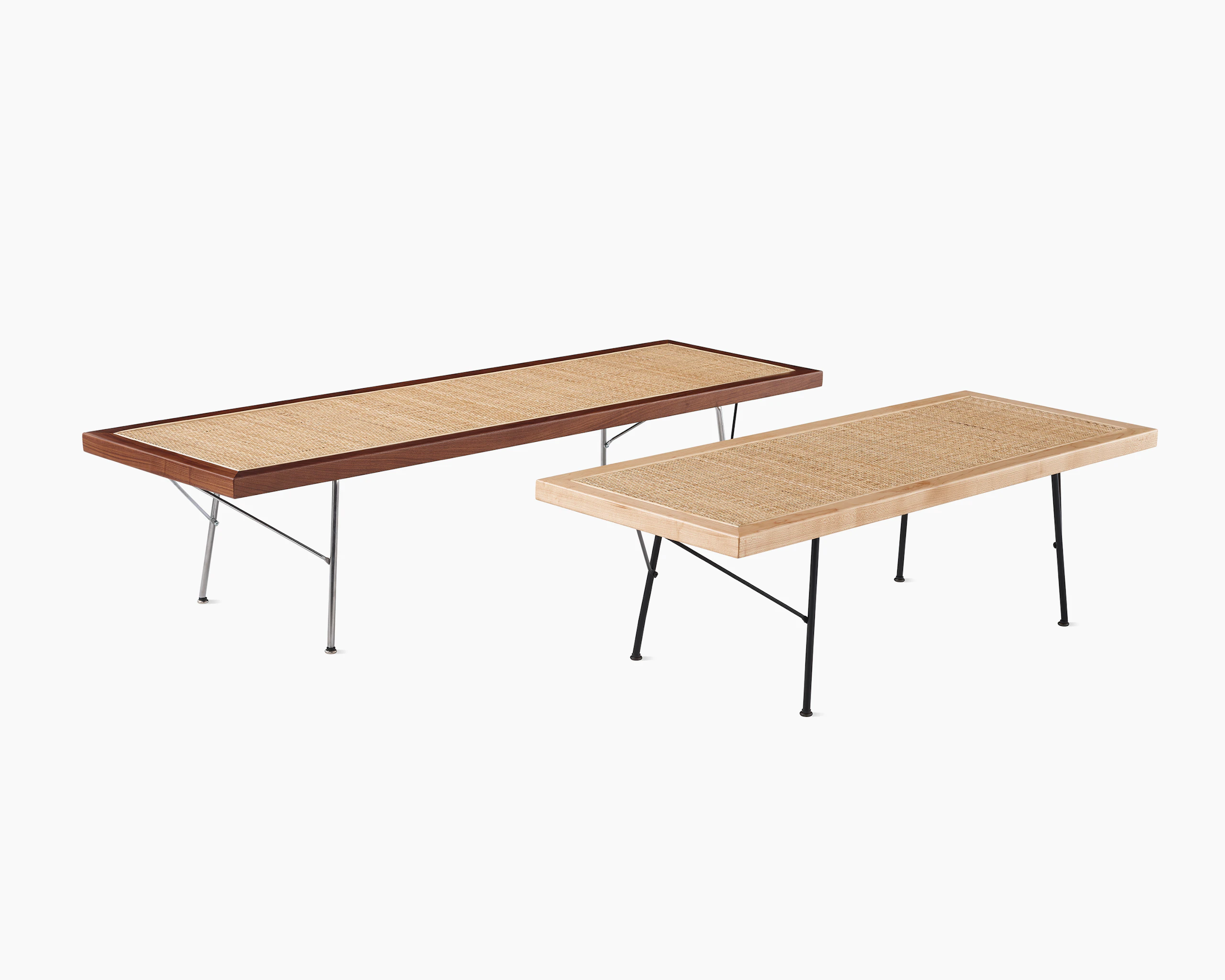 Two Nelson Cane Benches next to each other, one with a walnut frame and the other with a maple frame.