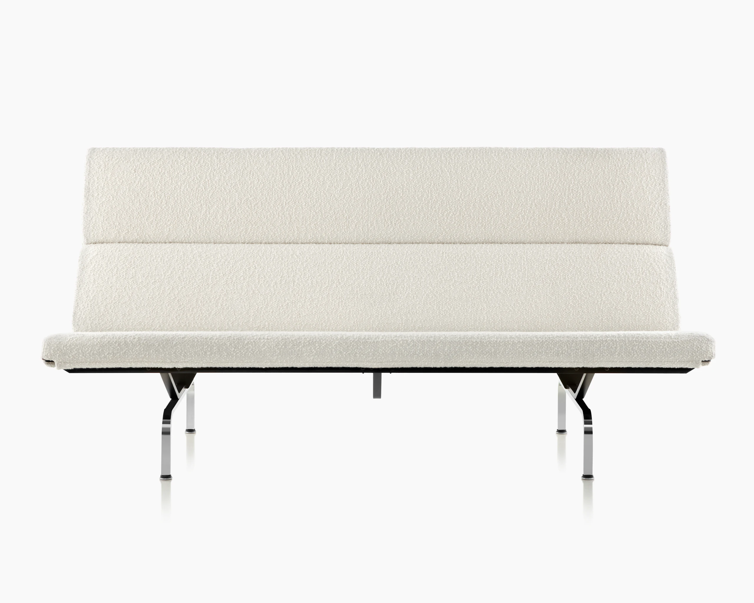 A Eames Sofa Compact upholstered in mt. stuart dove textile.