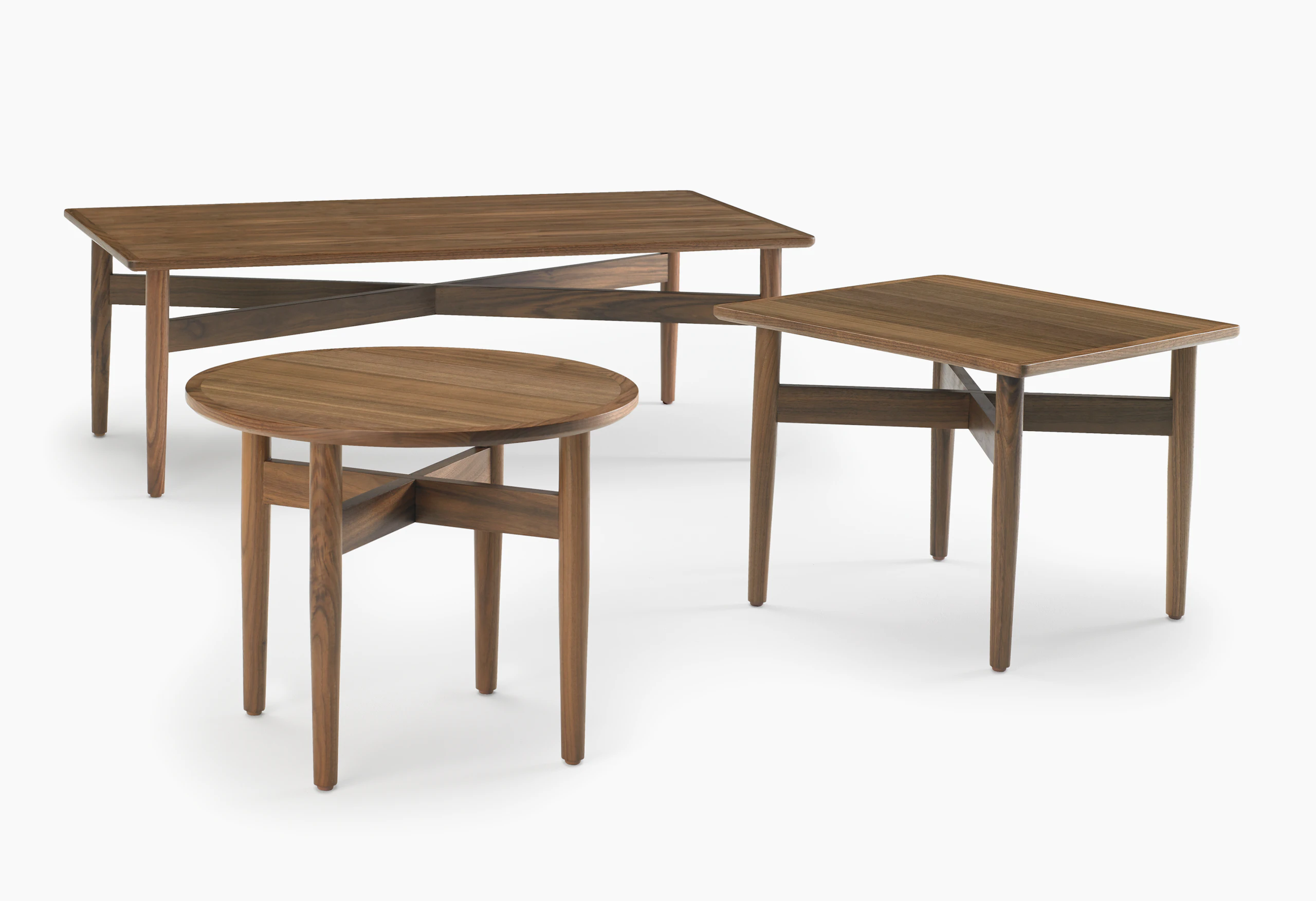 A round Hemlock end table, a square Hemlock end table, and a Hemlock Coffee Table, all in walnut.