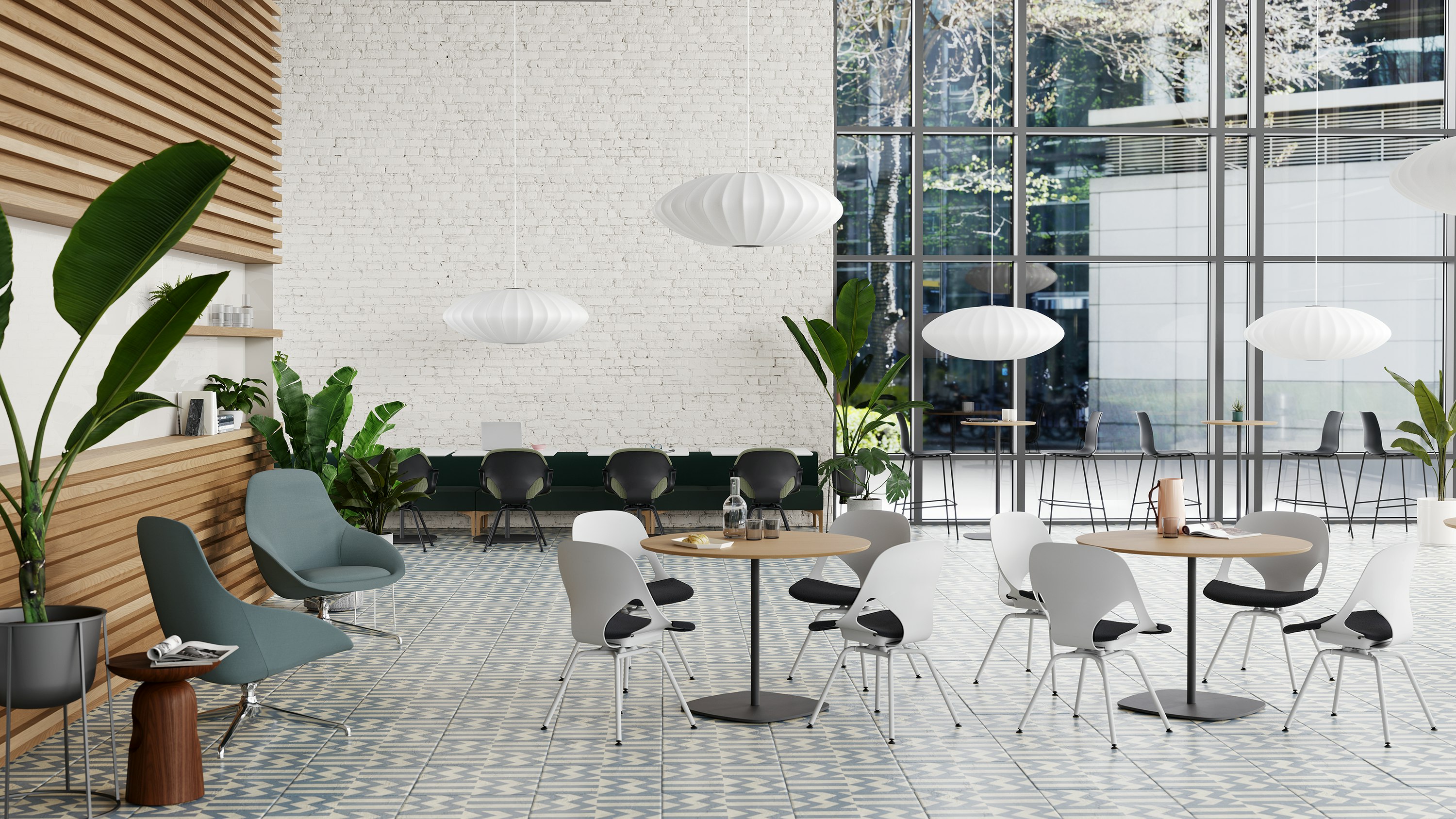 A Café that features light grey Zeph side chairs with a dark brown knit seat pad around round cafe tables, and a long modular sofa bordered with black Zeph side chairs with a green seat pad.
