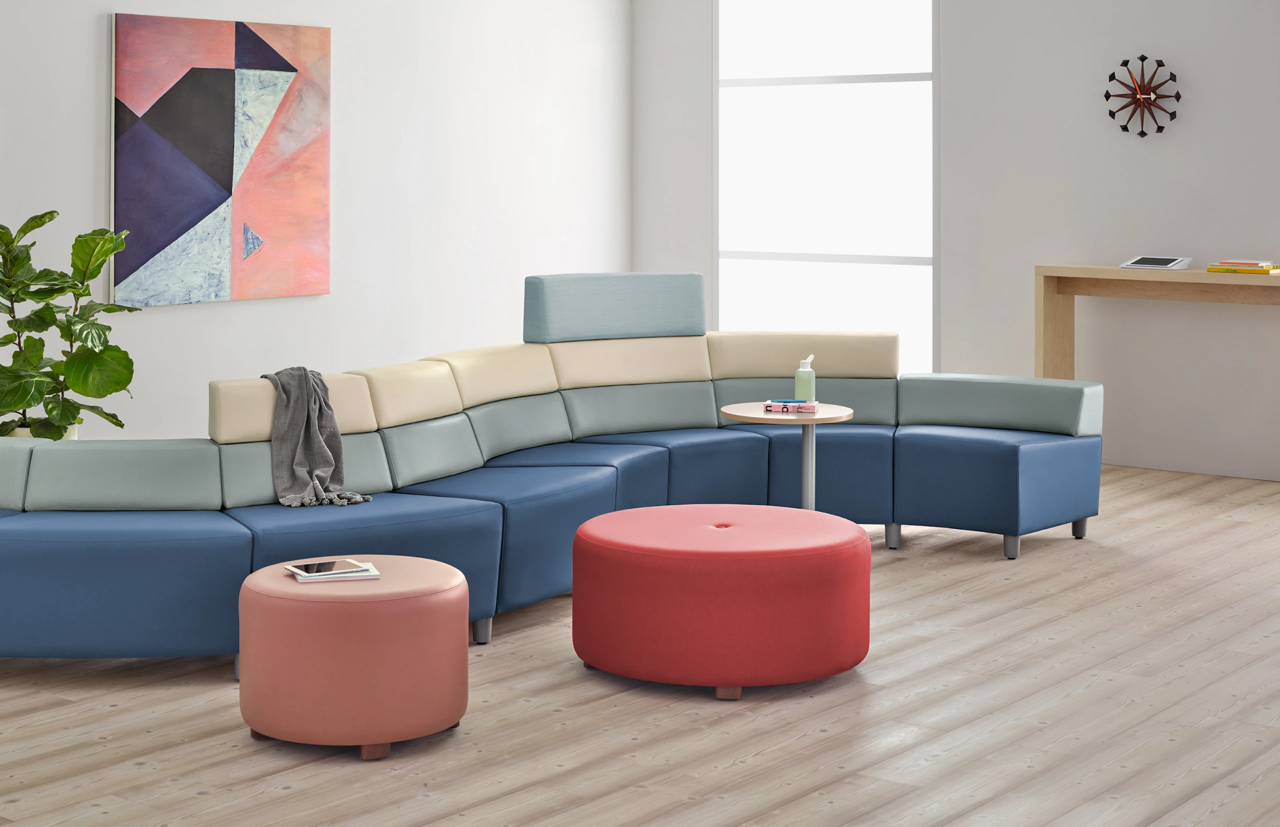 A waiting area with Nemschoff Steps Lounge System in a serpentine configuration with two ottomans and a side table.