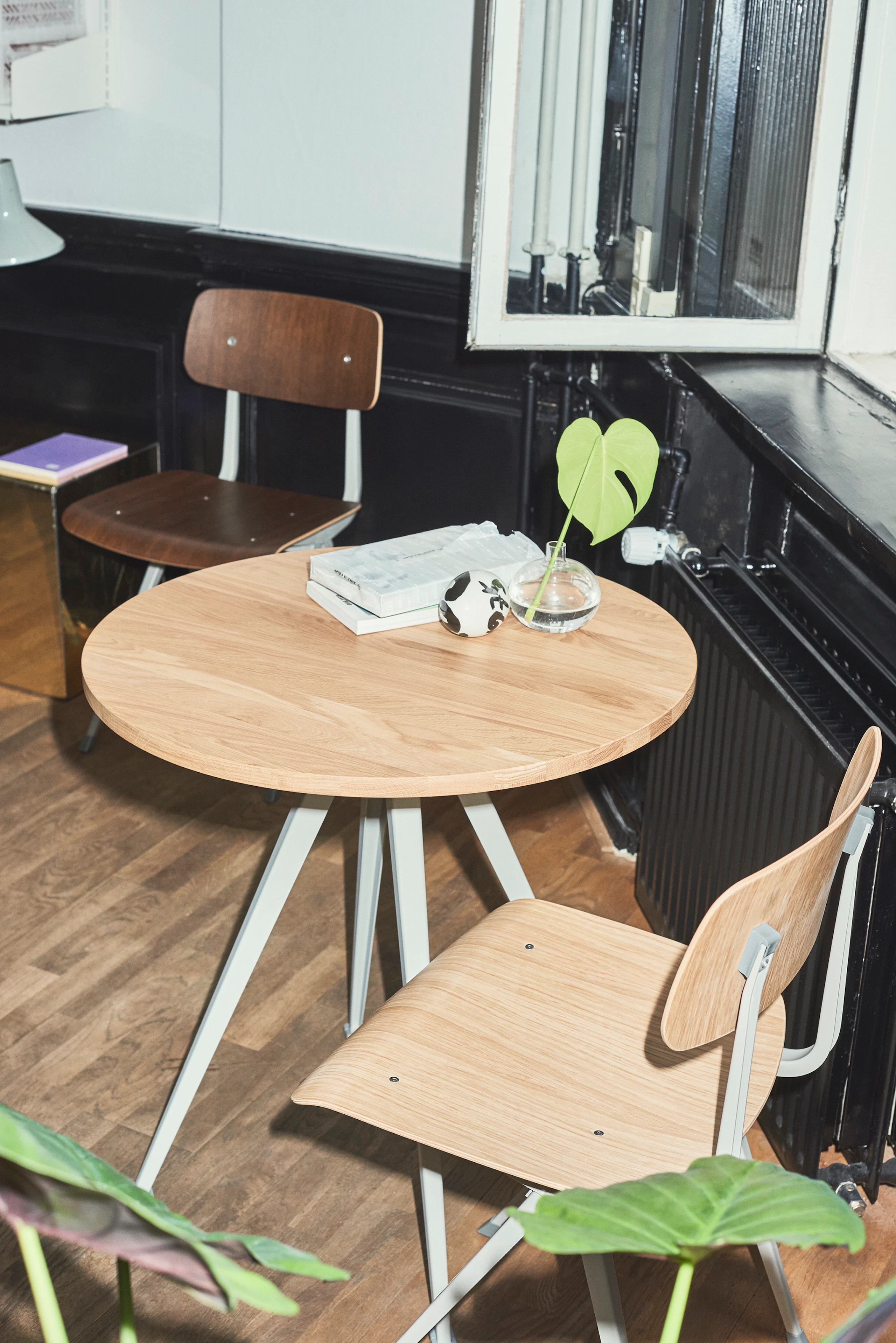 Pyramid Cafe Table with Oak top and beige frame next to two Result Chairs.