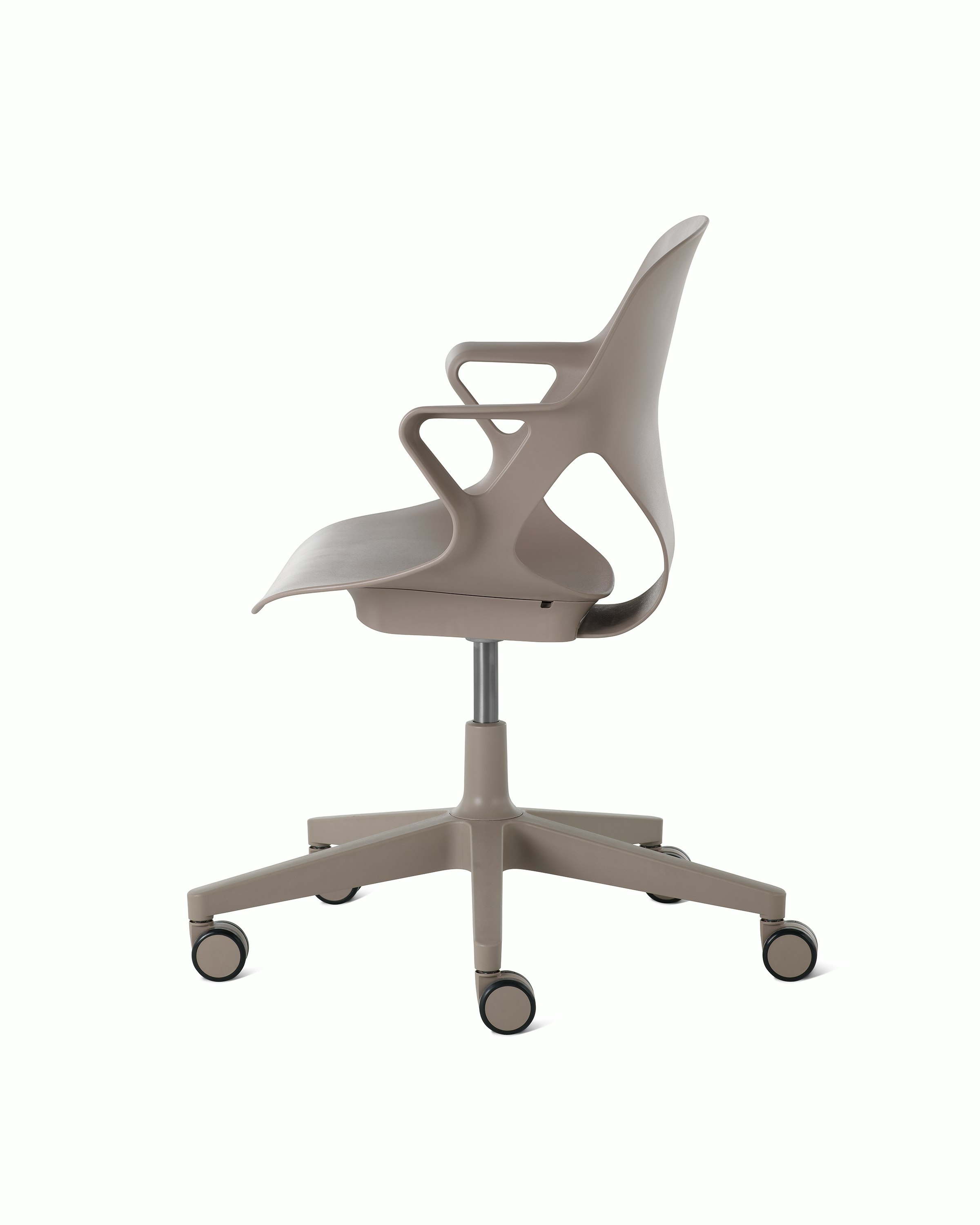 Side view of a Zeph chair with fixed arms in light brown.