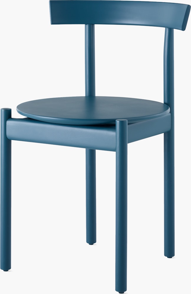 A blue Comma Chair, viewed from the front at an angle.