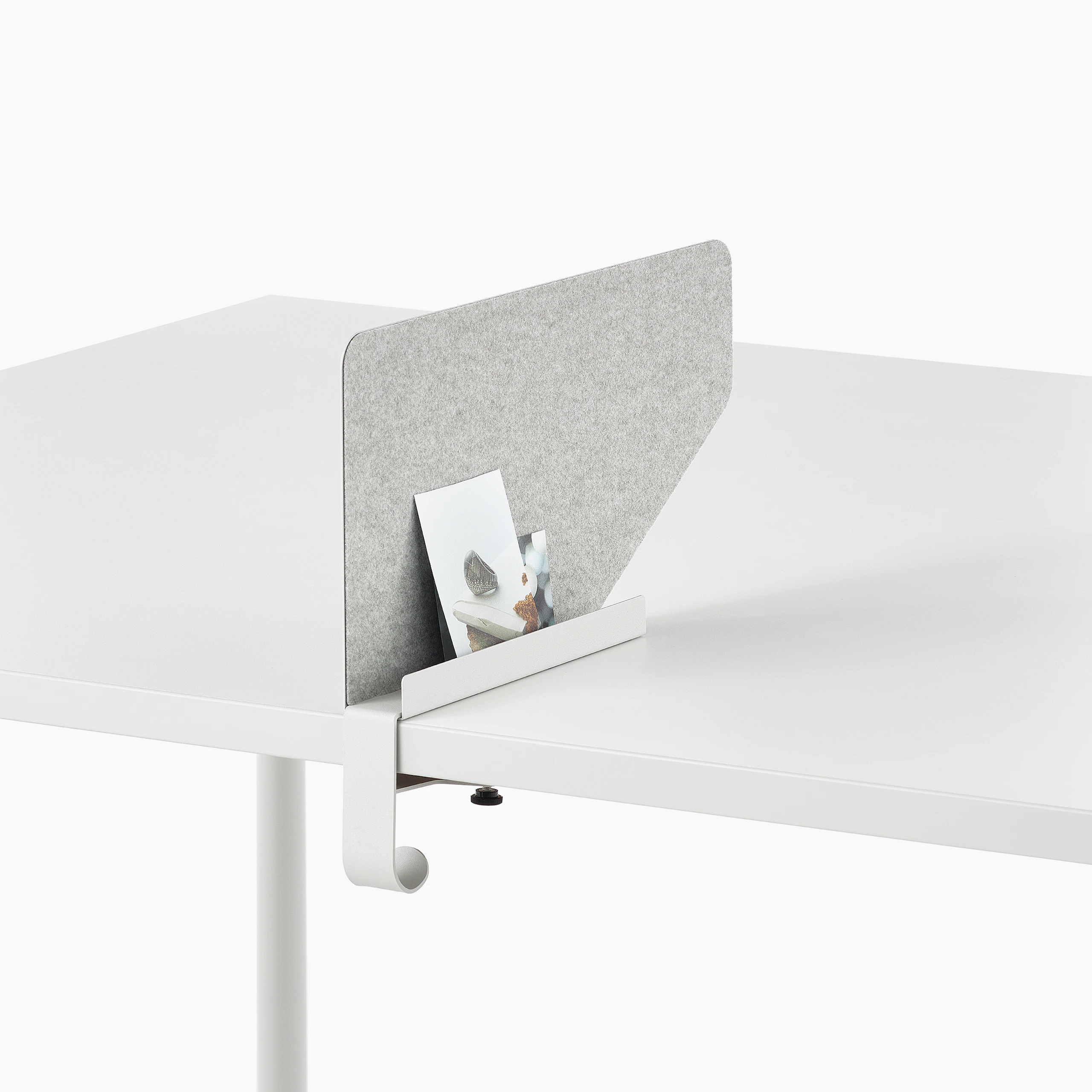 Grey OE1 Boundary Screen with liner on a white OE1 Rectangular Table, viewed from an angle.