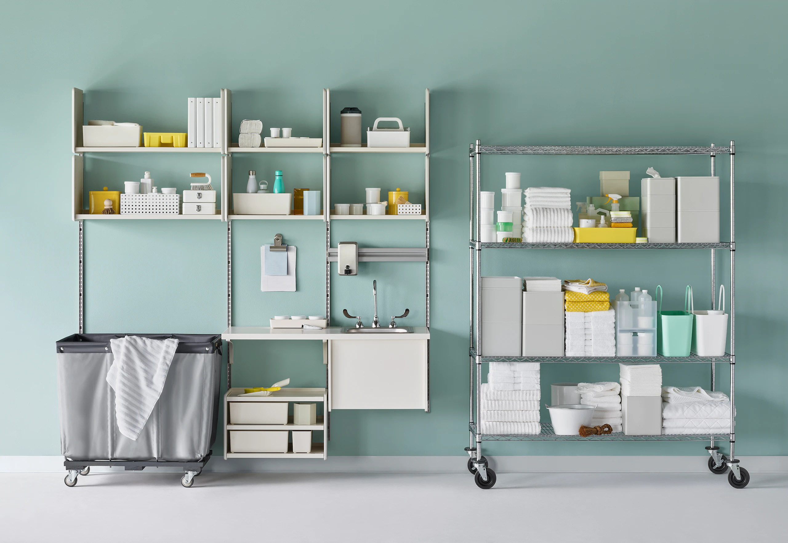 Medical soiled utility in soft white Co/Struc System including a sink and stainless steel wire shelving unit.