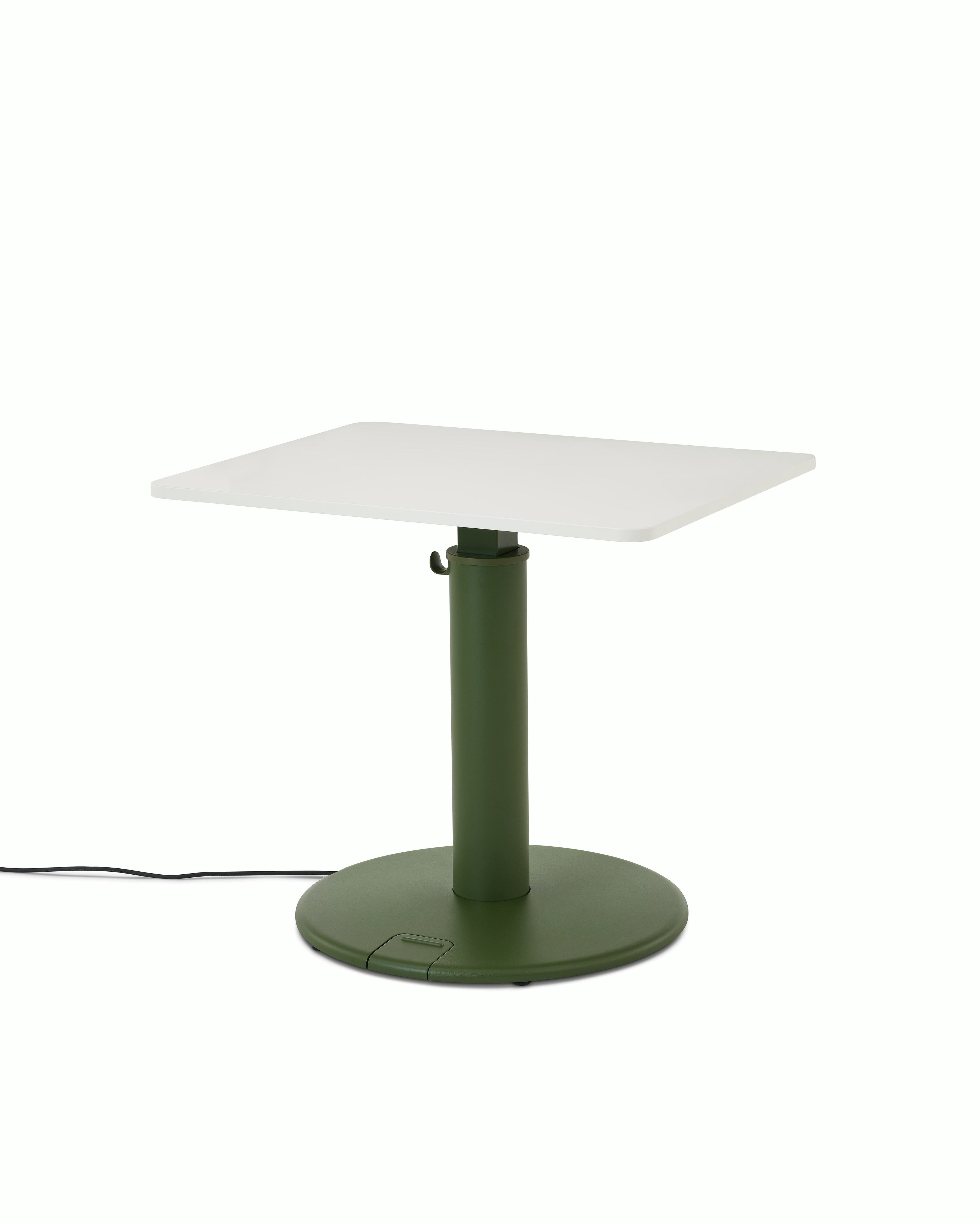 OE1 Sit-to-Stand Table at a standing height with green base and white rectangular surface viewed from a front angle. 