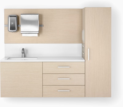 Mora casework in an ash finish and a white solid surface top and sink. The casework is wall-hung and has 3 drawers and one storage tower.
