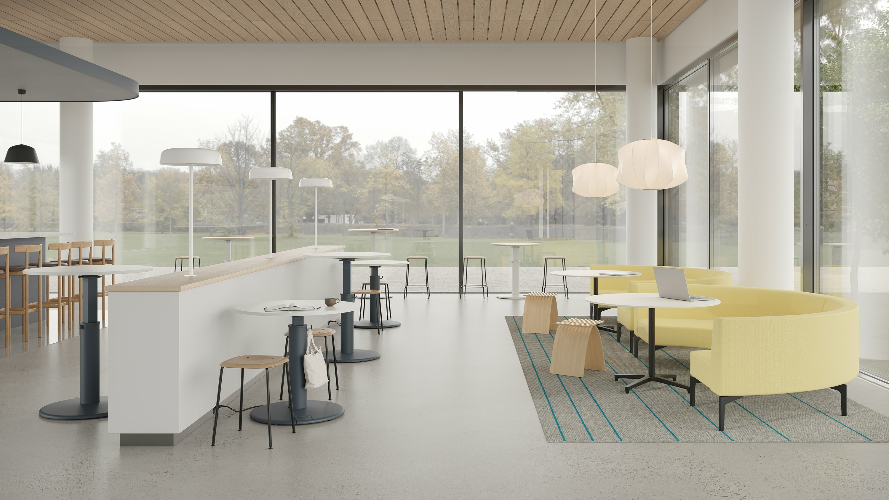 Community socialization area with OE1 Sit-to-Stand Tables, occasional tables and sofas.