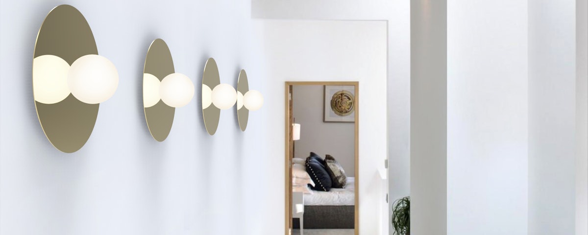 Four Bola Flush Mount Lamps on a hallway wall leading to a bedroom