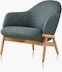 A mid-back Reframe Lounge Chair in Bellano Black Green, viewed from a three-quarter perspective.