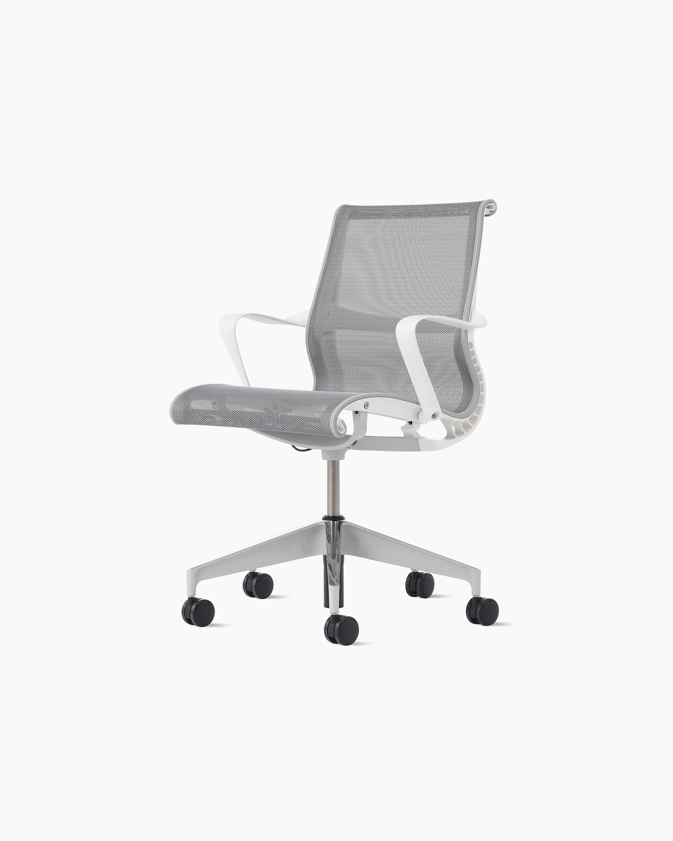 Front angle view of a Setu chair with a white frame, grey suspension and semi polished base.