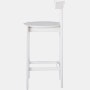 Profile view of a white counter-height Comma Stool.