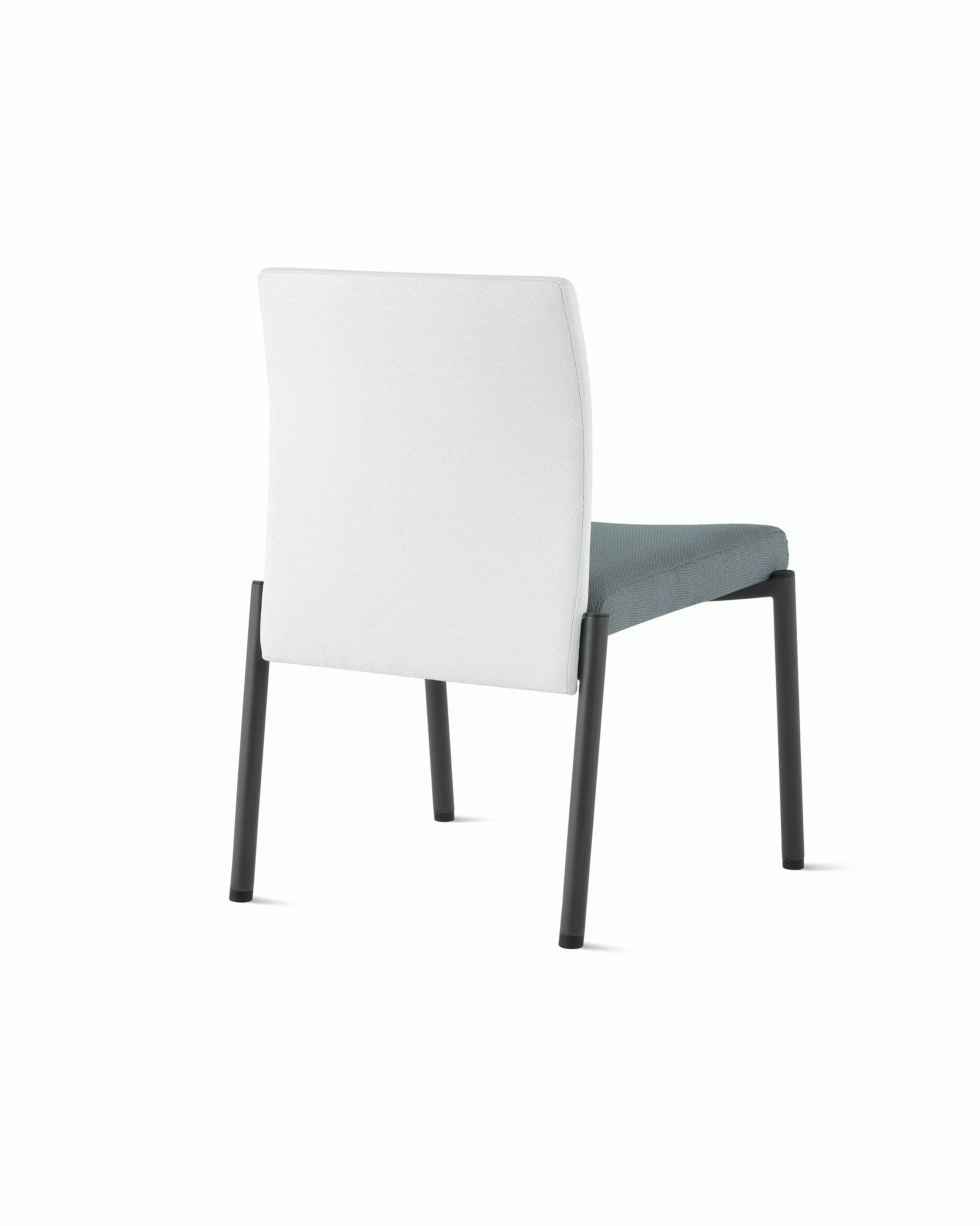 Three-quarter, back view of a Valor Stacking Chair without arms in a white back upholstery and a blue seat upholstery and black frame on white sweep.