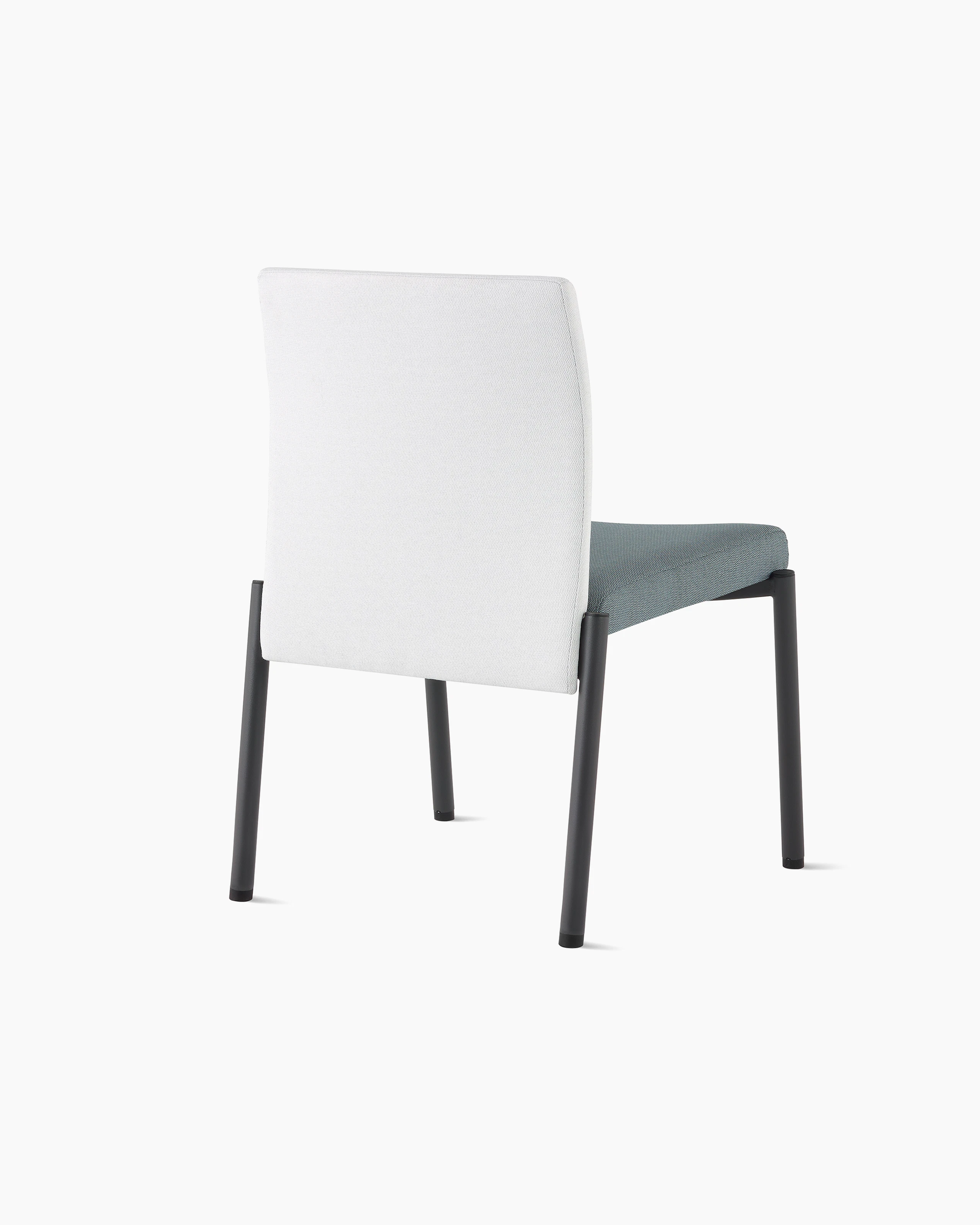 Three-quarter, back view of a Valor Stacking Chair without arms in a white back upholstery and a blue seat upholstery and black frame on white sweep.