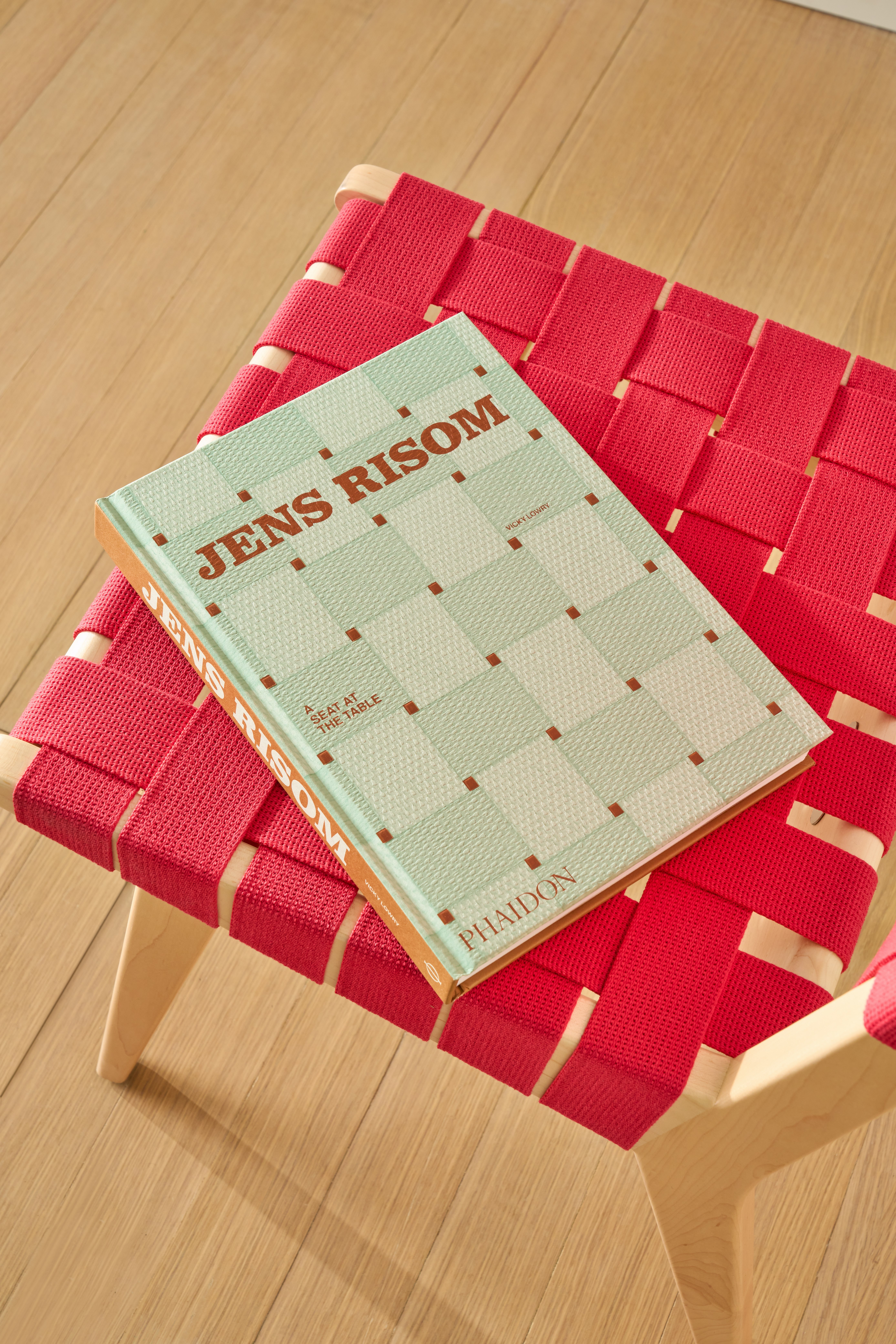 "A Seat at the Table" Book on a Risom Chair