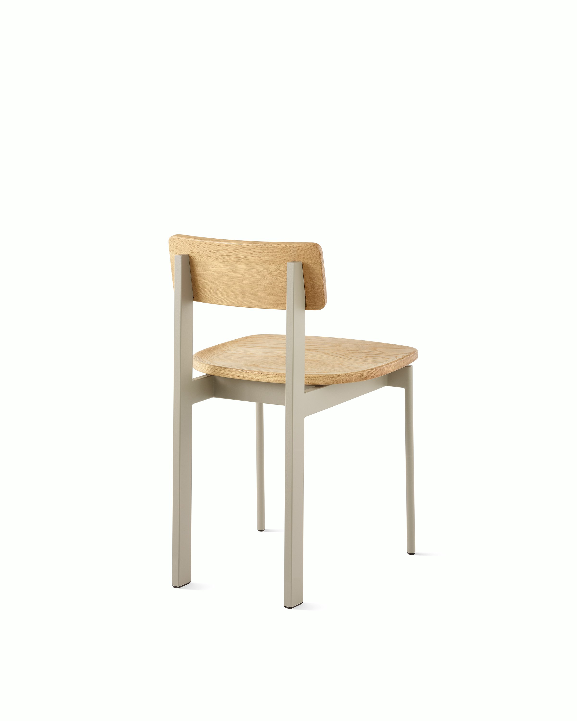 A Betwixt Chair with an oak seat and backrest with a grey frame. 