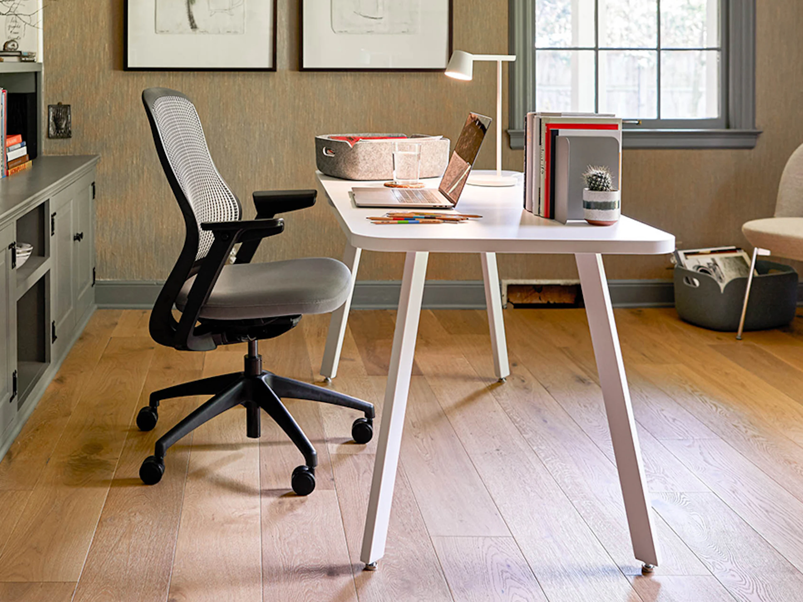 A white Rockwell Unscripted Easy Table with a ReGeneration Chair in a home office.