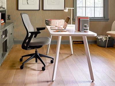 A white Rockwell Unscripted Easy Table with a ReGeneration Chair in a home office.