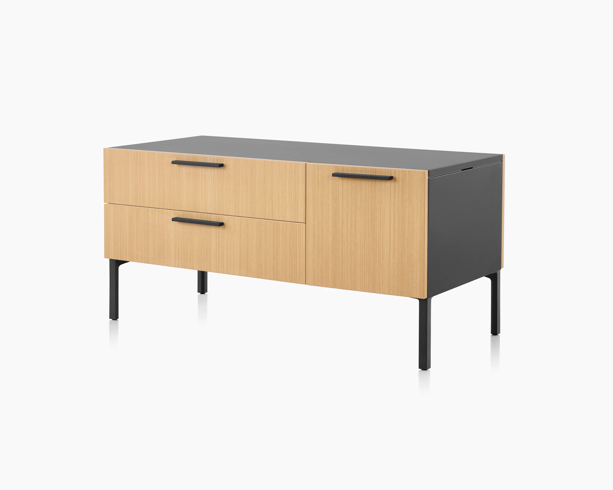 Brown and black Tu Wood shared credenza with box, tip-out tray and tip-out bin, viewed at an angle.