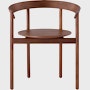 A walnut Comma Chair with arms, viewed from the front.