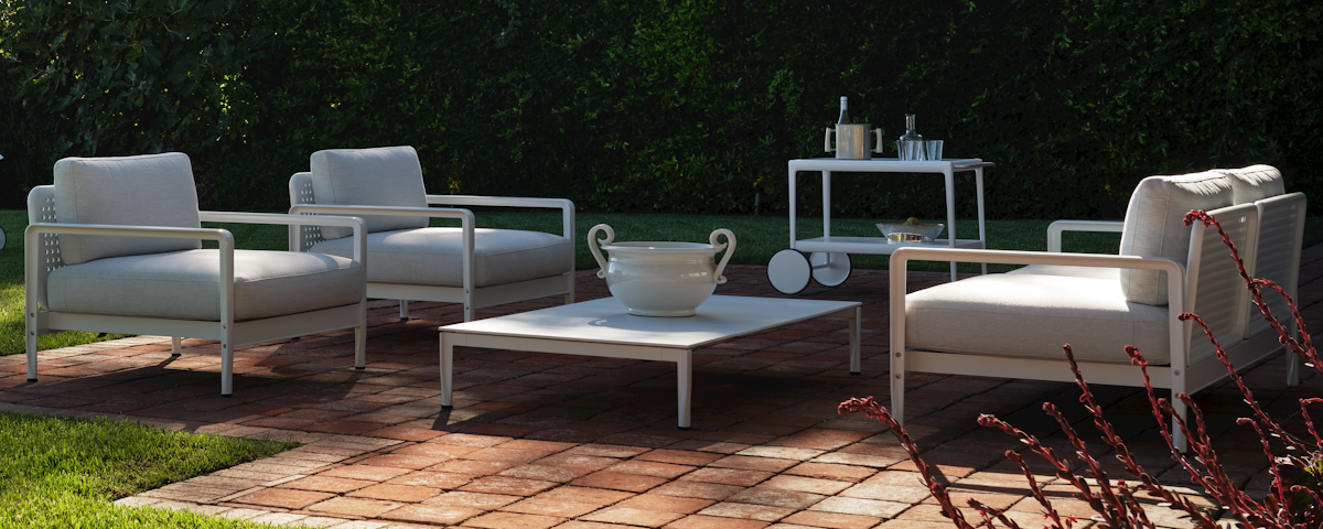 Lissoni Outdoor Coffee Table and Lissoni Outdoor Lounge Chairs in an outdoor patio setting