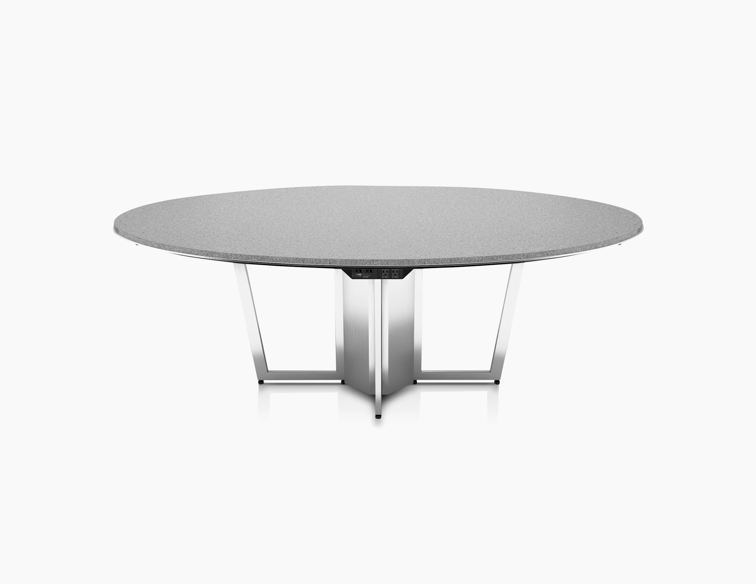 Highline Meeting Table with round Caesarstone Raw Concrete top, Polished Chrome base, undermount power, front view.