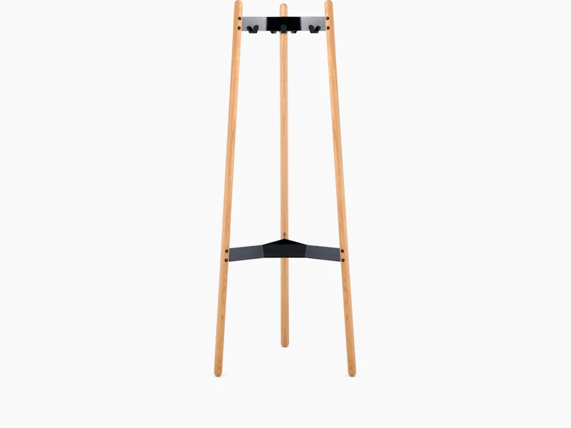 A front view of the Hudson Coat Stand with oak dowel legs with black metal supports.