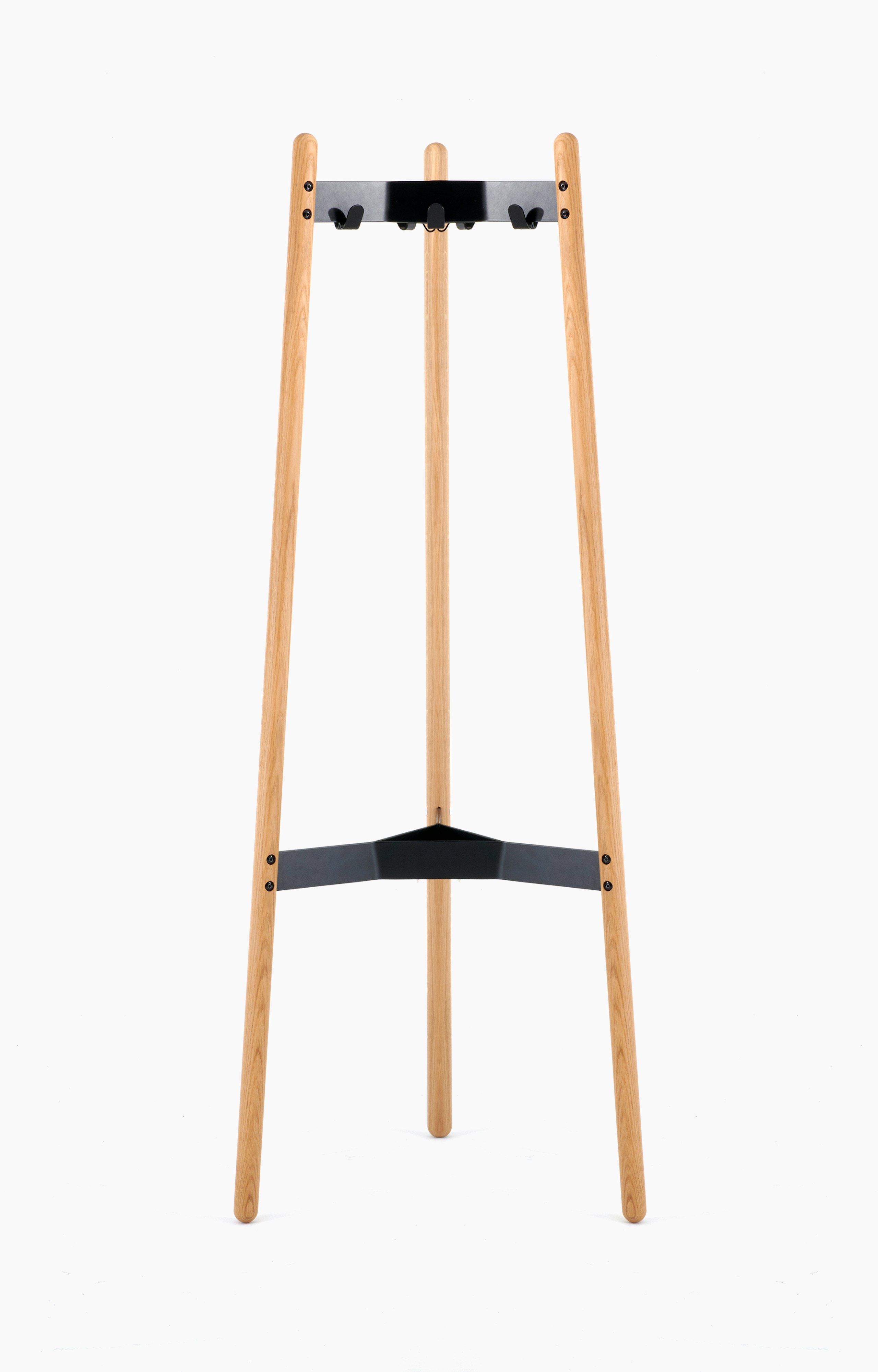 A front view of the Hudson Coat Stand with oak dowel legs with black metal supports.